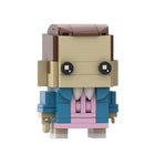 Bouwfiguur met groot hoofd Stranger Things Eleven in roze jurk